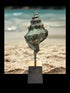 Bronzeskulptur af konkylie, ca. 15 cm høj, symboliserer styrke, beskyttelse og naturens skønhed, signeret Johannes Sampson.